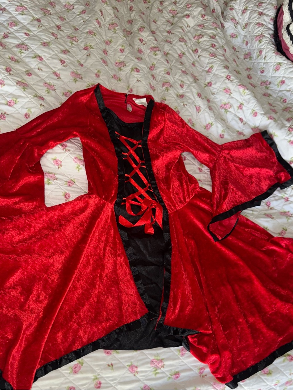 Red velvet dress with black trim and lace-up front, size L